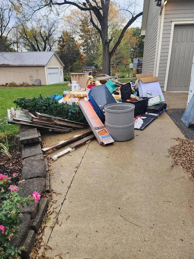 Dumpster being loaded with debris for Commercial Dumpster Rental in Leesylvania